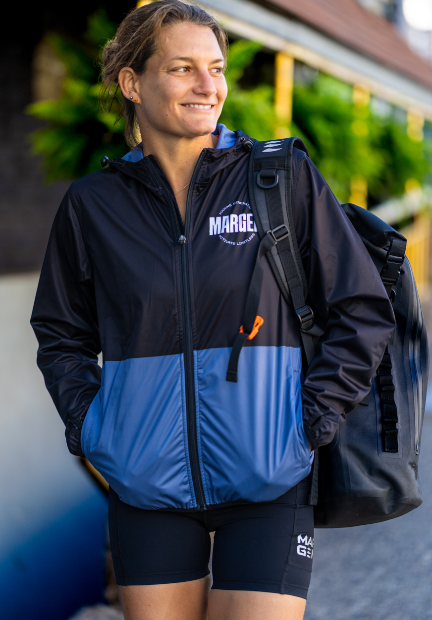 DRIFT Women's Jacket by MARGEN worn by a woman, ideal for outdoor activities and water adventures.